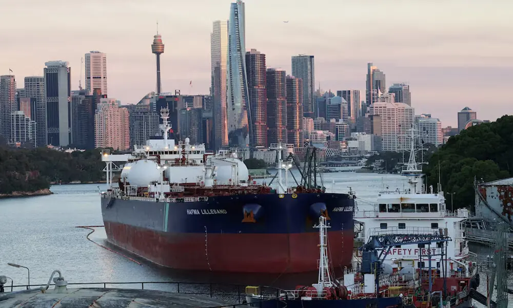 Hafnia Lillesand, a crude oil and product tanker, sits at Viva Energy Australia&rsquo;s Gore Bay fuel terminal overlooking the city skyline in Sydney, Australia. Reuters