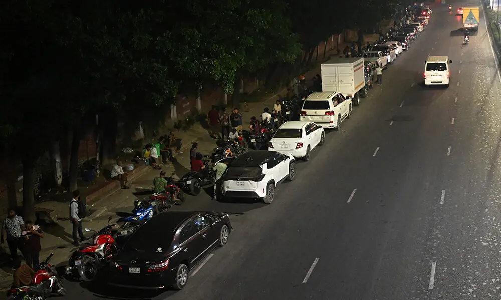 People queue up along a road, to refuel their vehicles at a filling station in Dhaka on April 21, 2026 amid Bangladesh’s fuel crisis triggered by the Middle East war. Photo: AFP People queue up along a road, to refuel their vehicles at a filling station in Dhaka on April 21, 2026 amid Bangladesh’s fuel crisis triggered by the Middle East war. Photo: AFP