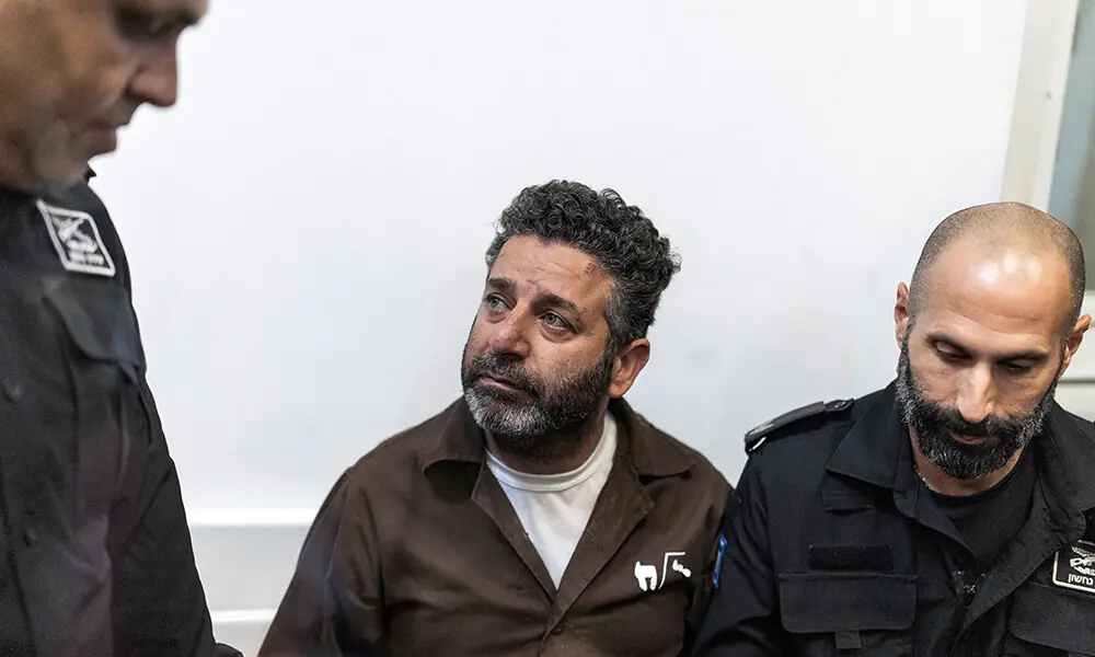 Israeli officers bring Spanish activist Saif Abu Keshek to a court in Ashkelon on May 5, 2026. Photo: AFP