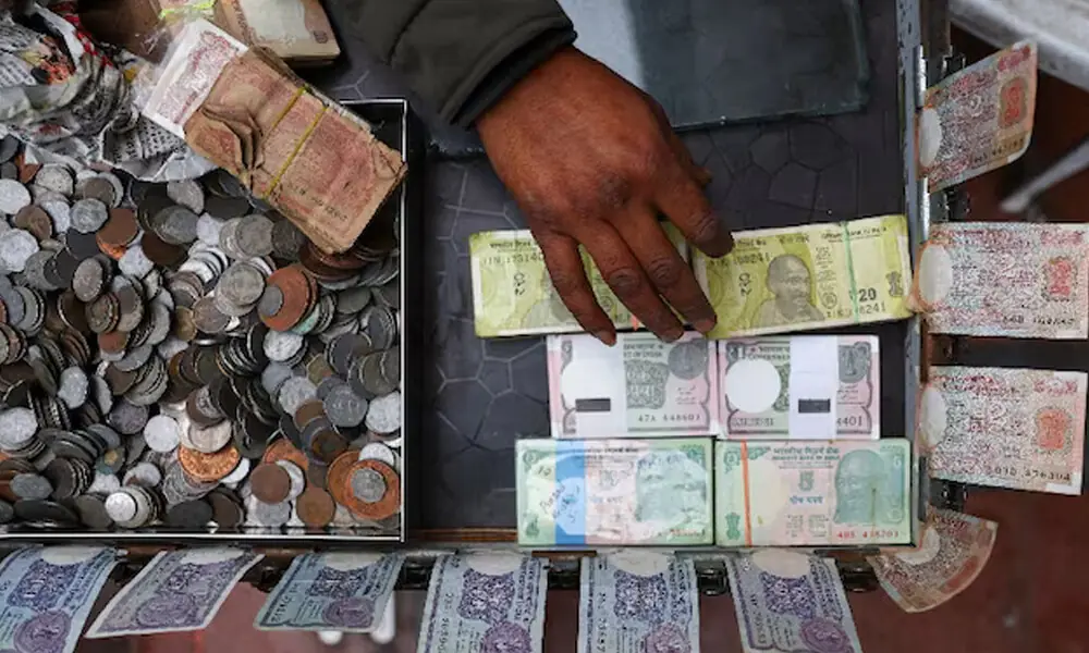 A vendor displays various denominations of Indian currency at a roadside currency exchange stall in the old quarters of Delhi, India, February 2, 2026. Photo: Reuters A vendor displays various denominations of Indian currency at a roadside currency exchange stall in the old quarters of Delhi, India, February 2, 2026. Photo: Reuters