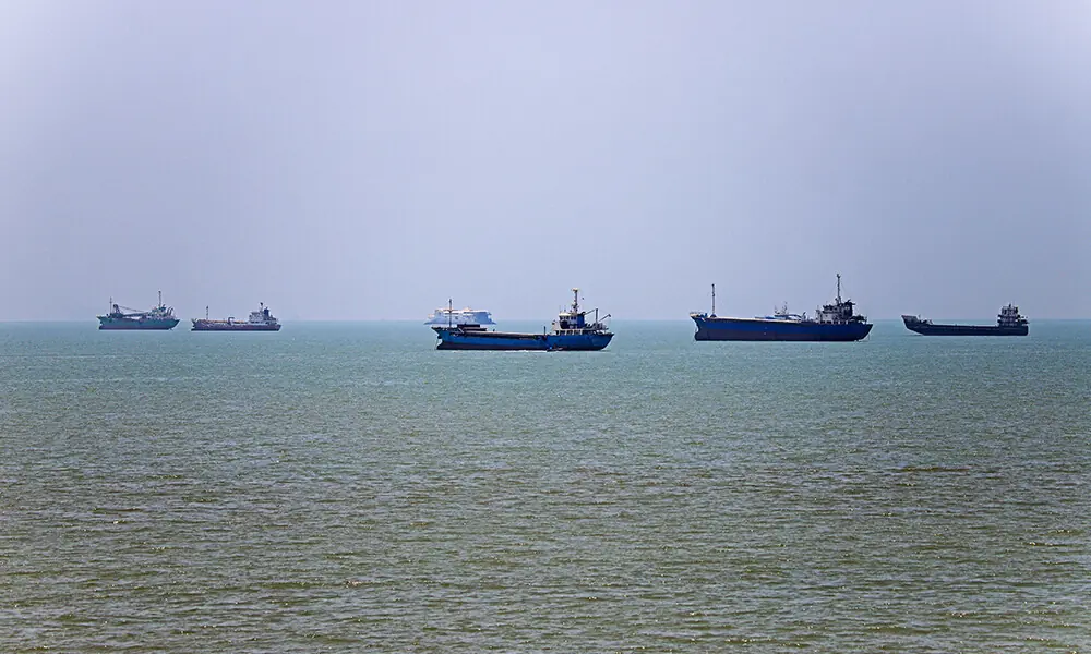 In this picture obtained from Iran's ISNA news agency on June 18, 2026, vessels are seen anchored in Bandar Abbas along the Strait of Hormuz. Photo: AFP