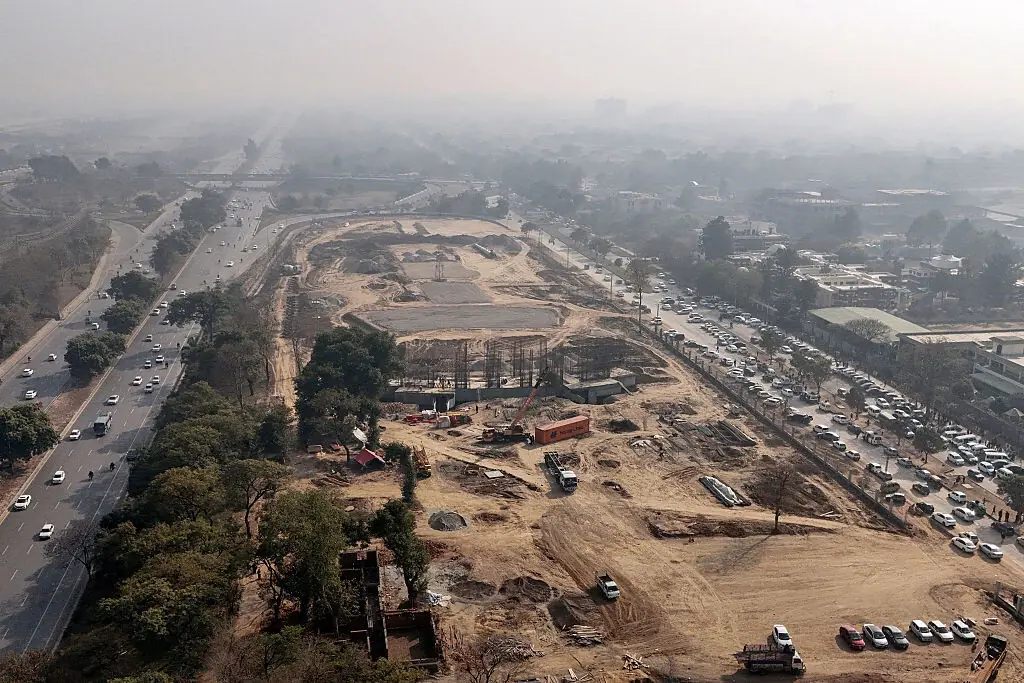 This photograph taken on January 13, 2026 shows ongoing construction work after felling trees near the Shakarparian forest in Islamabad. (Photo by Aamir QURESHI / AFP)