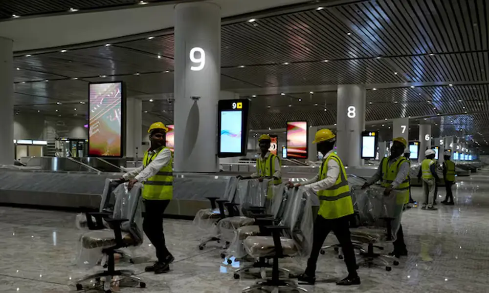 Workers move chairs in a baggage claim area inside the newly built Navi Mumbai International Airport, in Navi Mumbai, Maharashtra, India, December 17, 2025. REUTERS Workers move chairs in a baggage claim area inside the newly built Navi Mumbai International Airport, in Navi Mumbai, Maharashtra, India, December 17, 2025. REUTERS