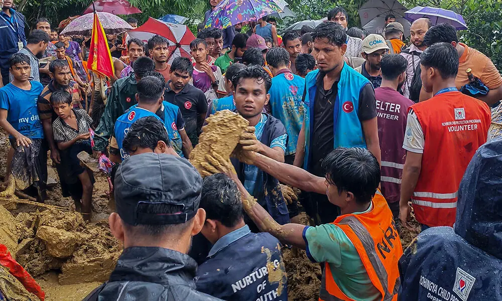 Bangladesh rescue personnel and volunteers work at the site of a landslide triggered by heavy rains at a school in the Kutupalong refugee camp in Cox's Bazar on July 8, 2026. Photo: AFP Bangladesh rescue personnel and volunteers work at the site of a landslide triggered by heavy rains at a school in the Kutupalong refugee camp in Cox's Bazar on July 8, 2026. Photo: AFP