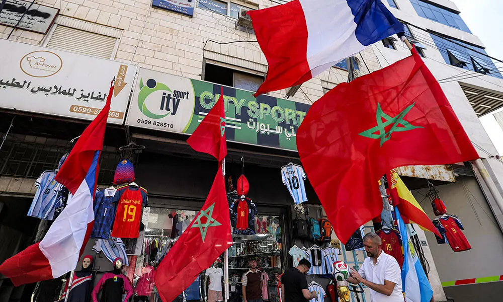Flags of Morocco and France fly outside a sports apparel shop selling 2026 FIFA World Cup-affiliated merchandise in the city of Hebron in the occupied West Bank on July 8, 2026, a day ahead of the world cup quarter-final football match between France and Morocco. Photo: AFP Flags of Morocco and France fly outside a sports apparel shop selling 2026 FIFA World Cup-affiliated merchandise in the city of Hebron in the occupied West Bank on July 8, 2026, a day ahead of the world cup quarter-final football match between France and Morocco. Photo: AFP