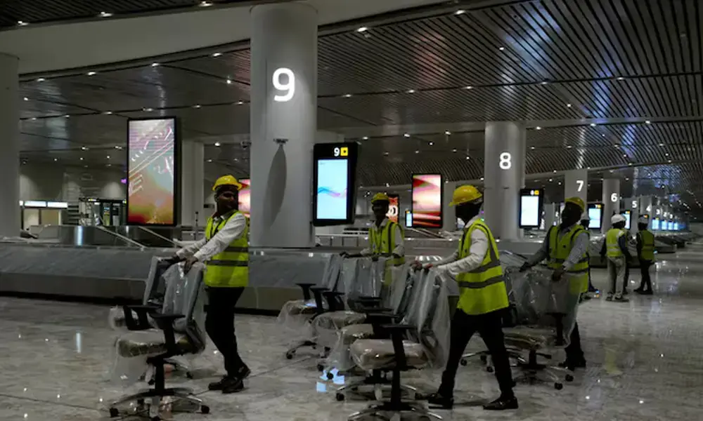 Workers move chairs in a baggage claim area inside the newly built Navi Mumbai International Airport, in Navi Mumbai, Maharashtra, India, December 17, 2025. Photo: Reuters Workers move chairs in a baggage claim area inside the newly built Navi Mumbai International Airport, in Navi Mumbai, Maharashtra, India, December 17, 2025. Photo: Reuters