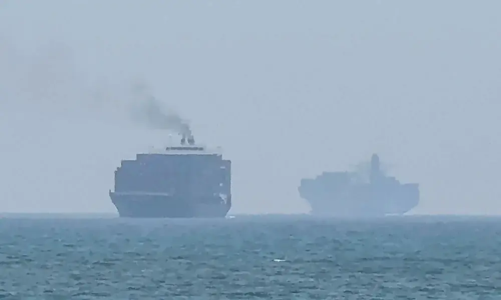 This frame grab taken from AFPTV video footage on July 12, 2026 shows cargo ships anchoring near the Strait of Hormuz off the eastern coast of the United Arab Emirates at Khor Fakkan. Photo: AFP