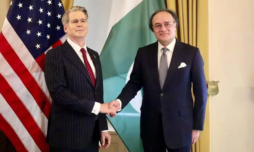 Pakistani Finance Minister Muhammad Aurangzeb and US Treasury Secretary Scott Bessent shake hands as they meet in Washington, DC, US, July 21, 2026. Ministry of Finance/Handout via Reuters