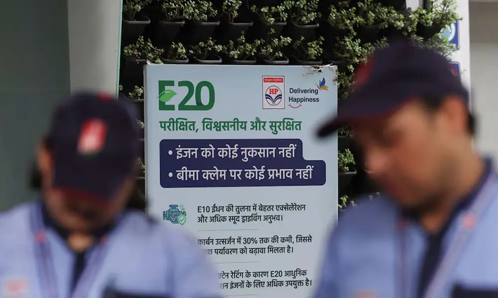 Workers stand near a signboard with information on E20 petrol at a Hindustan Petroleum fuel station in New Delhi, India, August 3, 2026. Photo: Reuters Workers stand near a signboard with information on E20 petrol at a Hindustan Petroleum fuel station in New Delhi, India, August 3, 2026. Photo: Reuters