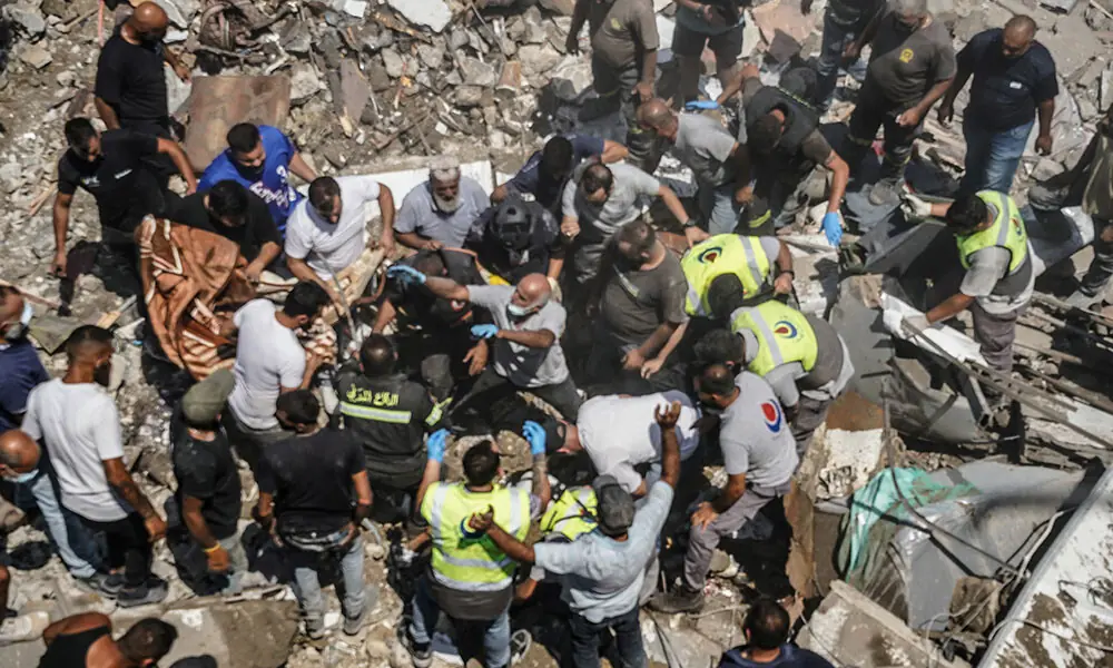 First aid responders and residents gather as they search the site of an Israeli airstrike that targeted a neighbourhood in the southern Lebanese village of Deir al-Zahrani on August 15, 2026. Photo: AFP First aid responders and residents gather as they search the site of an Israeli airstrike that targeted a neighbourhood in the southern Lebanese village of Deir al-Zahrani on August 15, 2026. Photo: AFP
