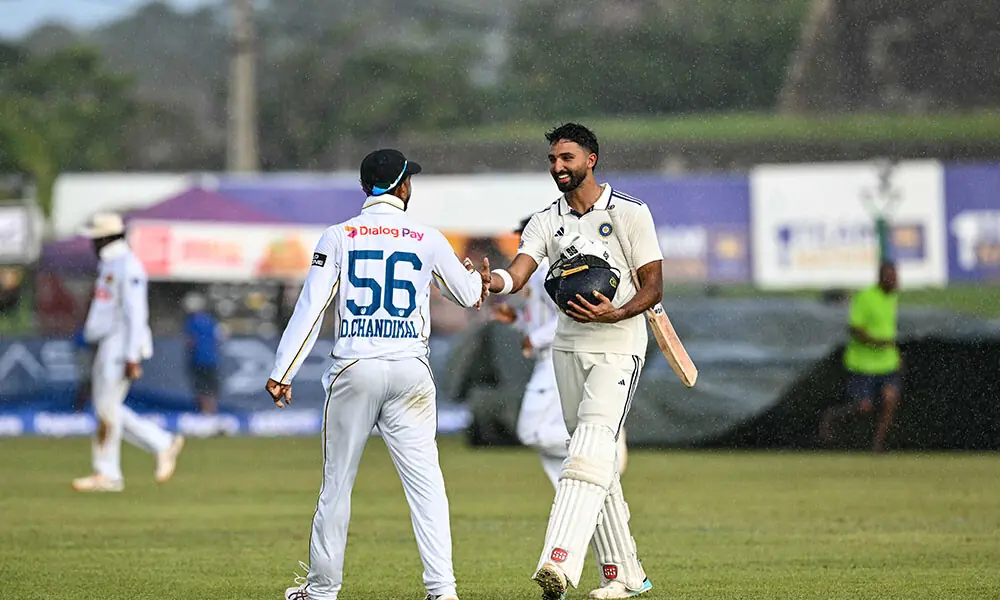 India's Devdutt Padikkal (R) and Sri Lanka's Dinesh Chandimal shake hands as they walk back to the pavilion during rain on the first day of the first Test cricket match between Sri Lanka and India at the Galle International Stadium in Galle on August 15, 2026. Photo: AFP India's Devdutt Padikkal (R) and Sri Lanka's Dinesh Chandimal shake hands as they walk back to the pavilion during rain on the first day of the first Test cricket match between Sri Lanka and India at the Galle International Stadium in Galle on August 15, 2026. Photo: AFP