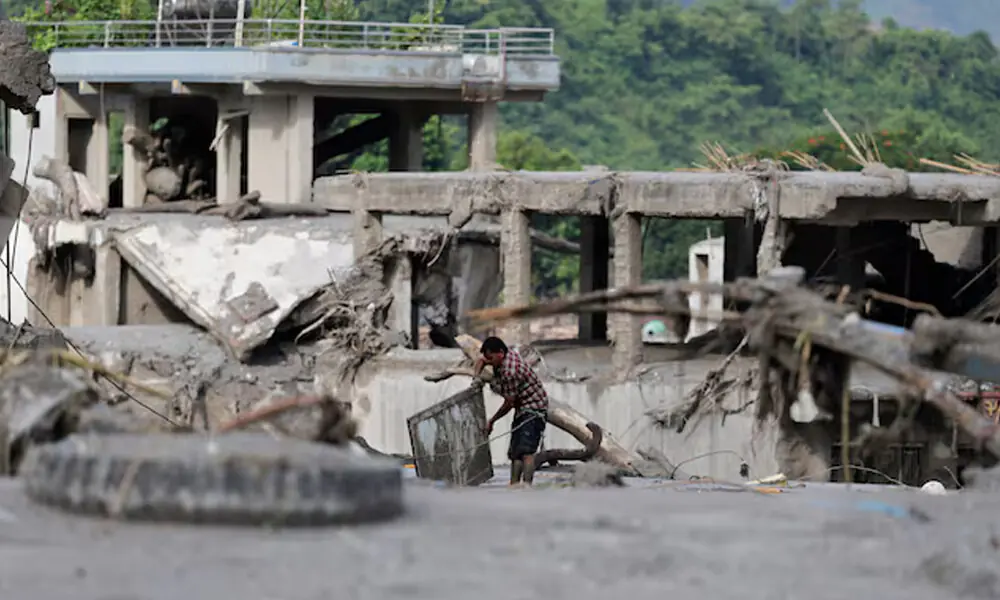 A man salvages his belongings from mud following devastating floods, in Trishuli in Nuwakot district, Nepal, August 27, 2026. REUTERS A man salvages his belongings from mud following devastating floods, in Trishuli in Nuwakot district, Nepal, August 27, 2026. REUTERS