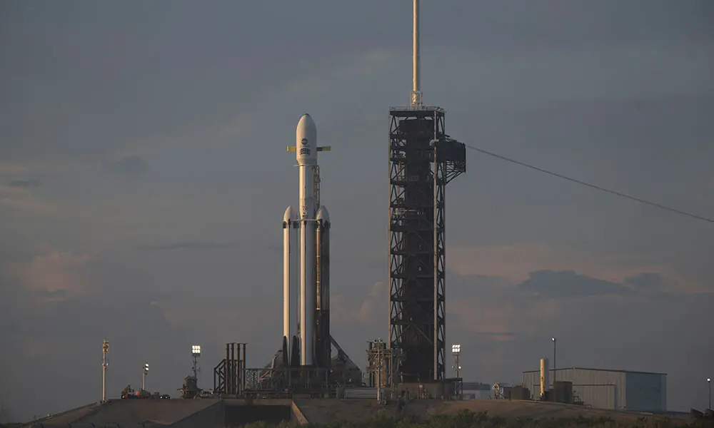 In this NASA handout, NASA's Nancy Grace Roman Space Telescope, encapsulated in a protective payload fairing atop a SpaceX Falcon Heavy rocket, is seen at sunrise on August 29, 2026, at Launch Complex 39A at NASA's Kennedy Space Center in Cape Canaveral, Florida. Photo: AFP