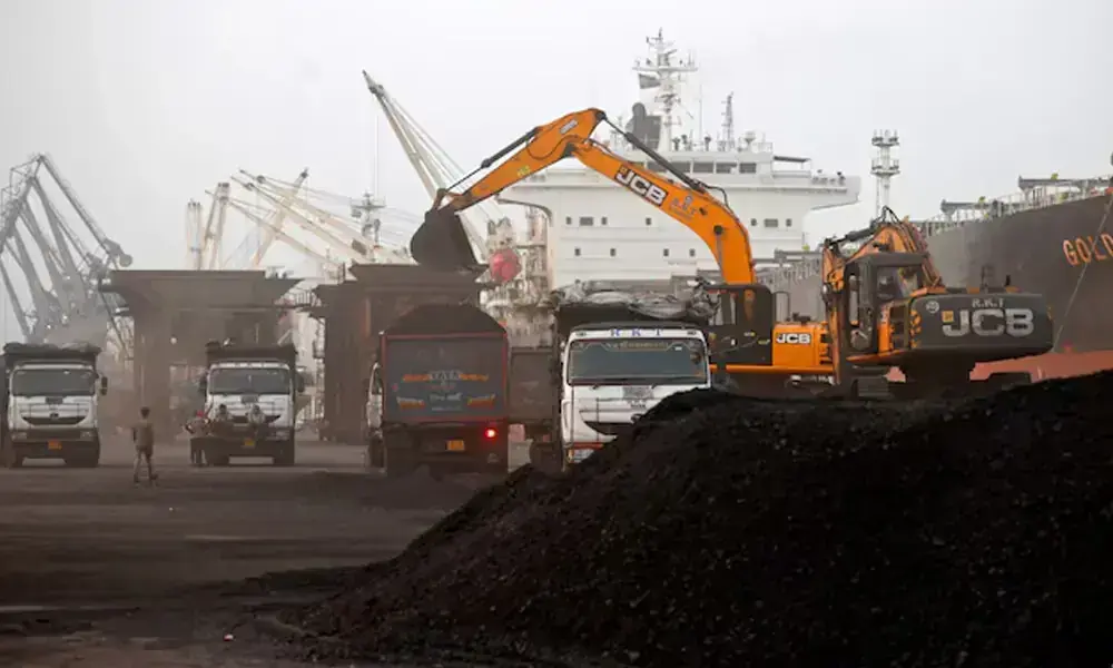 A JCB machine loads coal onto a dumper at the Deendayal Port in Kandla, in the western state of Gujarat, India, September 25, 2024. File Photo: Reuters