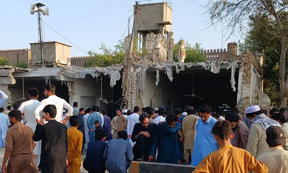 Onlookers gather at the site of an explosion inside the police headquarters at Kohat in Khyber Pakhtunkhwa on September 18, 2026. Photo: AFP