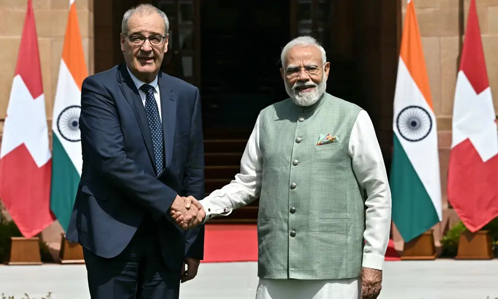 India's Prime Minister Narendra Modi (R) and Switzerland's President Guy Parmelin shake hands before their meeting at the Hyderabad House in New Delhi on October 5, 2026. Photo. AFP