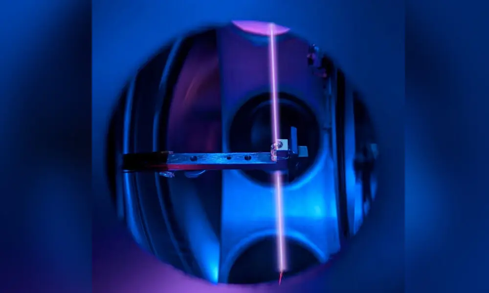 A calcium fluoride crystal, in its holder, that incorporates large numbers of thorium nuclei is seen inside the vacuum system of a nuclear clock, with a laser beam probing the thorium nuclei, at a laboratory at TU Wien in Vienna, Austria, in this handout image released on October 7, 2026. Reuters A calcium fluoride crystal, in its holder, that incorporates large numbers of thorium nuclei is seen inside the vacuum system of a nuclear clock, with a laser beam probing the thorium nuclei, at a laboratory at TU Wien in Vienna, Austria, in this handout image released on October 7, 2026. Reuters