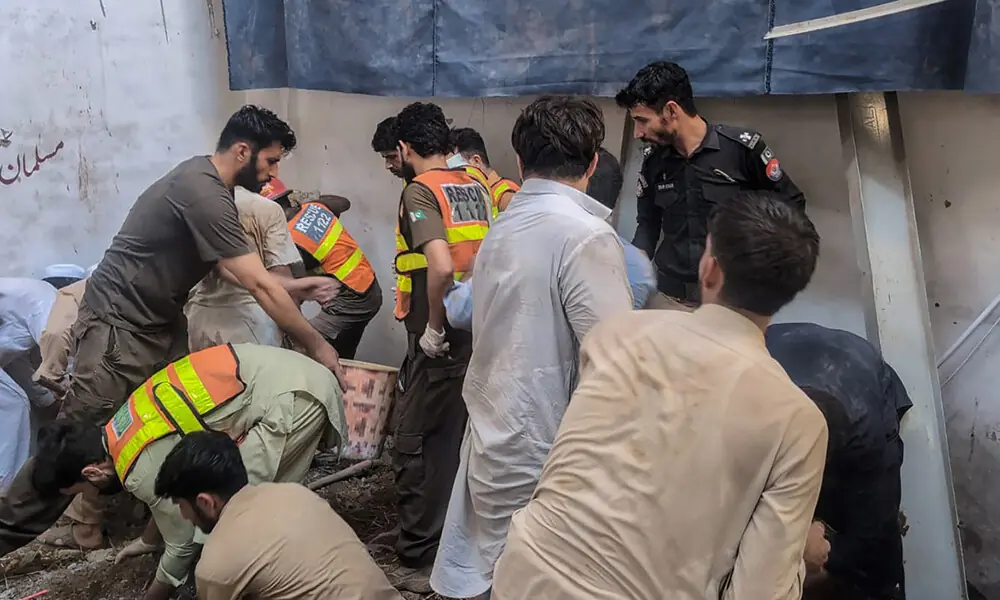 This photograph taken and released by the Khyber Pakhtunkhwa's Emergency Service (Rescue 1122) on October 15, 2026 shows rescue workers during a search operation after a roof collapsed at a school in Peshawar. This photograph taken and released by the Khyber Pakhtunkhwa's Emergency Service (Rescue 1122) on October 15, 2026 shows rescue workers during a search operation after a roof collapsed at a school in Peshawar.