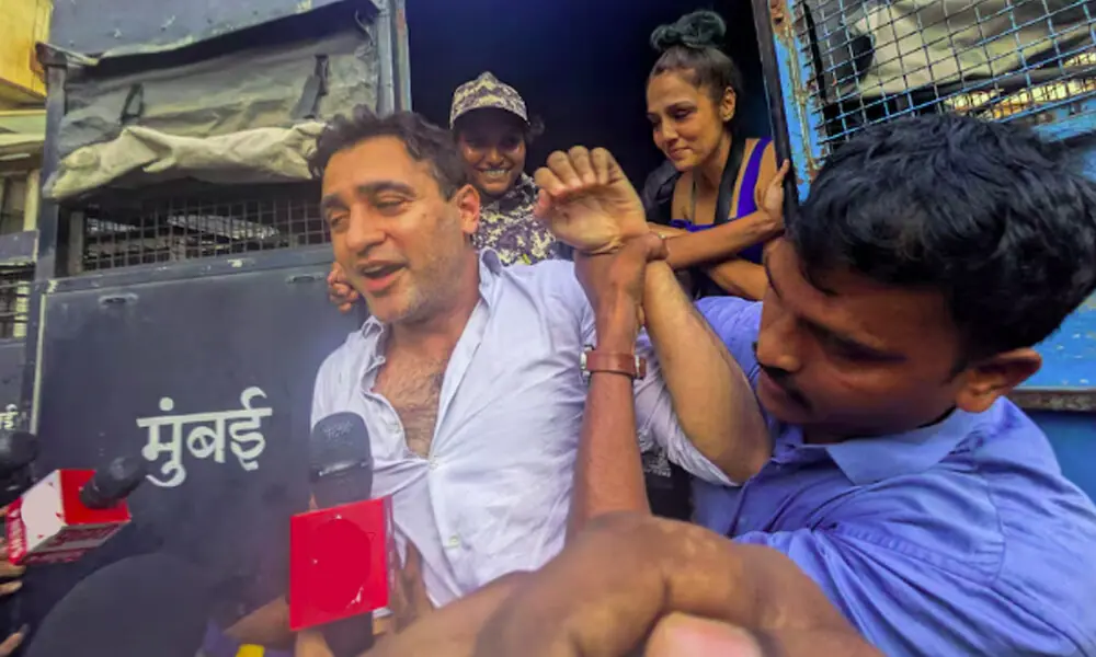 Bollywood actor Imran Khan is detained by security personnel during a protest by the Cockroach Janta Party (CJP) seeking the resignation of India's Chief Election Commissioner Gyanesh Kumar, in Mumbai, India, October 10, 2026. REUTERS