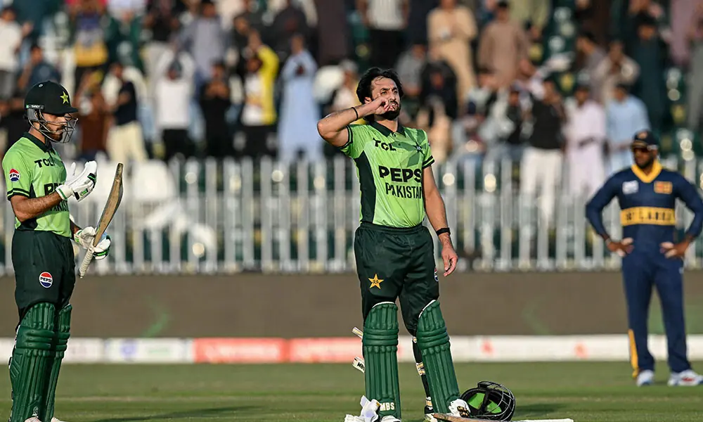 Pakistan's Salman Agha (C) celebrates after scoring a century (100 runs) as teammate Arafat Minhas (L) watches during the tri-series one-day international (ODI) cricket match between Pakistan and Sri Lanka at the Rawalpindi Cricket Stadium in Rawalpindi on October 18, 2026. Photo: AFP