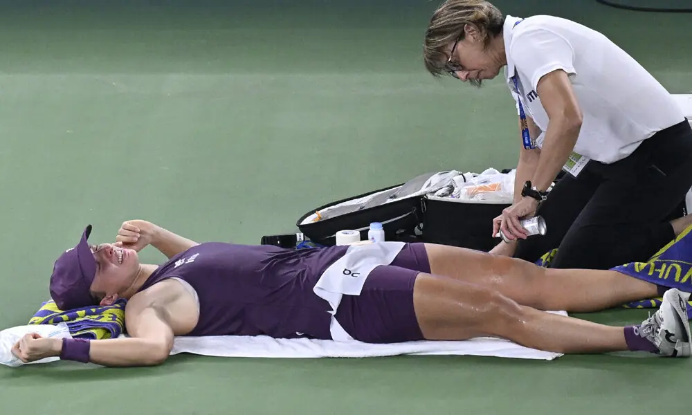 Poland&rsquo;s Iga Swiatek receives medical treatment during her women's singles semi-final match against Poland&rsquo;s Maja Chwalinska at the Wuhan Open tennis tournament in Wuhan. Photo: AFP