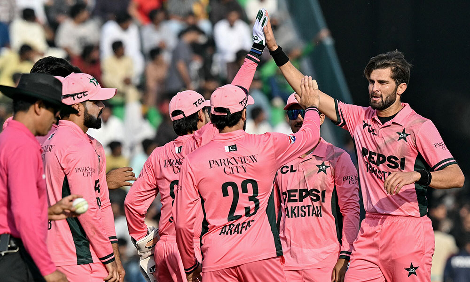 Pakistan's captain Shaheen Shah Afridi (R) celebrates with teammates after taking the wicket of England's Sam Curran during the one-day international (ODI) tri-series cricket match between Pakistan and England at the Gaddafi Stadium in Lahore on October 25, 2026. Photo: AFP Pakistan's captain Shaheen Shah Afridi (R) celebrates with teammates after taking the wicket of England's Sam Curran during the one-day international (ODI) tri-series cricket match between Pakistan and England at the Gaddafi Stadium in Lahore on October 25, 2026. Photo: AFP
