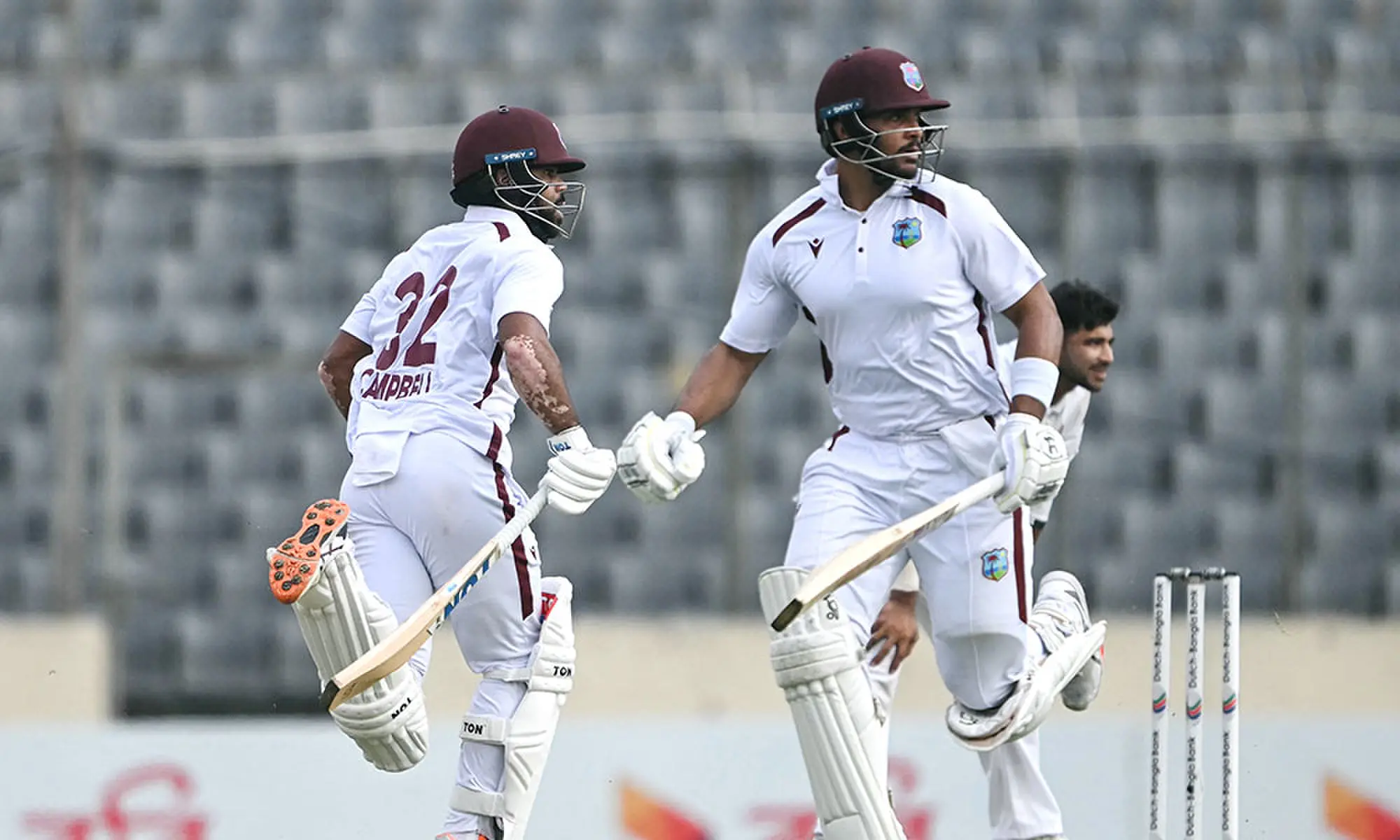 West Indies' John Campbell (L) and Brandon King run between the wickets during the fourth day of the first test cricket match between Bangladesh and West Indies at the Sher-e-Bangla National Stadium in Mirpur on October 31, 2026. Photo: AFP