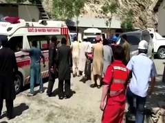 Bus blast kills 13, including 9 Chinese