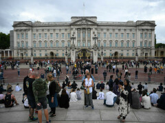 Crowds gather outside Buckingham Palace