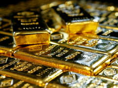 Gold edges up on softer dollar, Fed slowdown hopes