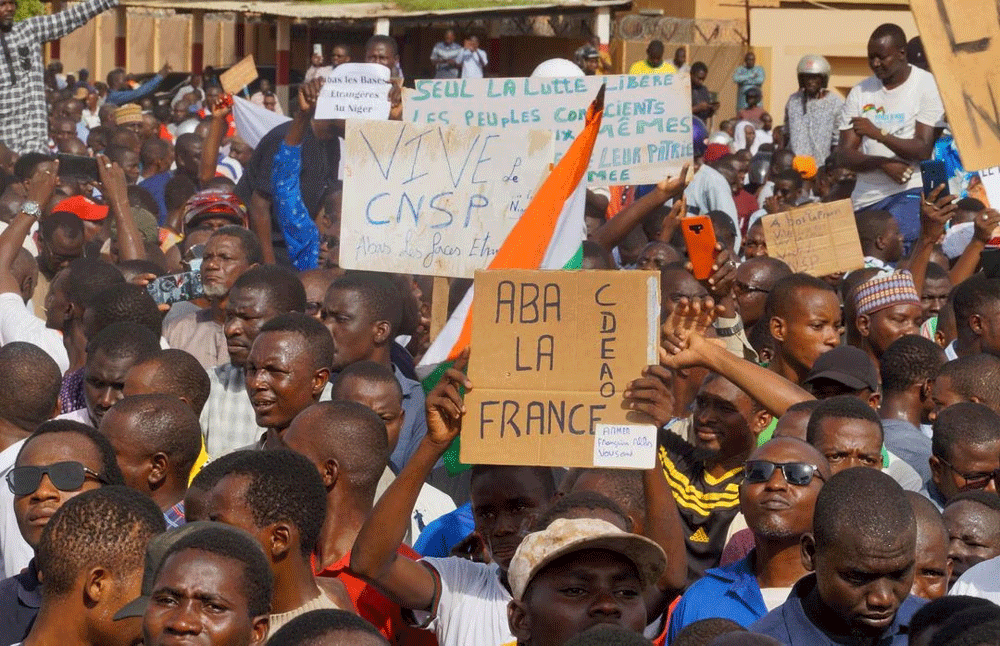 West Africa threatens force on Niger coup leaders, French embassy attacked