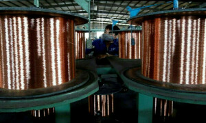 Copper retreats on stronger dollar and rising LME stocks