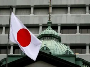 Japan govt approves record budget, including for defence