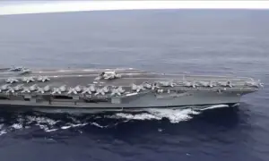 US deploys aircraft carrier as Iran warns against attack
