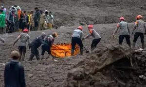 Search for 32 people missing in Indonesia landslide hampered by rain as death toll rises to 34