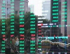 China stocks close higher as gains in communications sector outweigh property losses