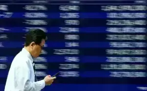 Wall St futures, dollar drop amid US tariff tumult