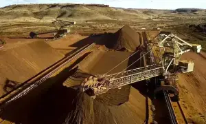 Iron ore dips, pressured by steel output curbs in Tangshan, high stocks