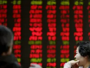 China, HK stocks fall on Middle East worries; focus on NPC for policy cues