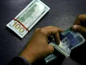Rupee registers gain against US dollar