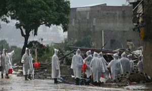 Rescuers search for survivors of China storms as super typhoon nears