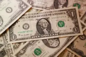 Dollar rides yield surge as Middle East and trade wars raise inflation stakes