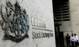 UK stocks close higher as weaker sterling boosts export-heavy sectors
