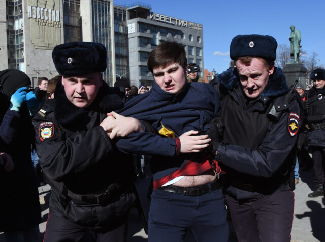Opposition leader arrested as Russians defy protest bans