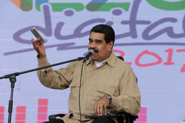 After outcry, Venezuela's Maduro announces review of court power grab