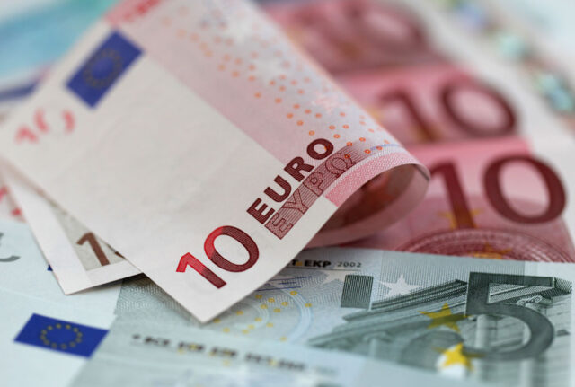 Euro hits three-week low as Draghi cools tightening expectations
