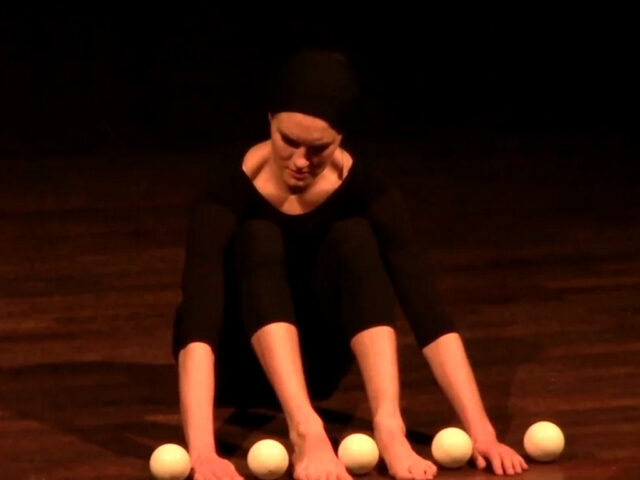 Amazing woman juggles with her feets Amazing woman juggles with her feets