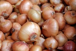 India sets curbs on onion exports as prices surge