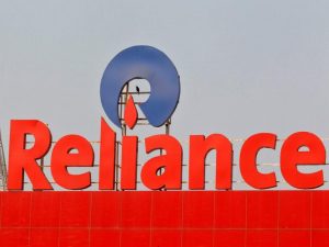 India's Reliance sells power unit to Adani to reduce debt