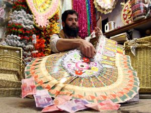 Old tradition of currency notes garlands dying